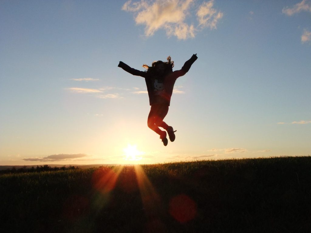 woman jumping into the air