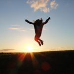 woman jumping into the air