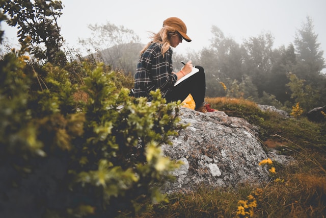 A woman journaling outside