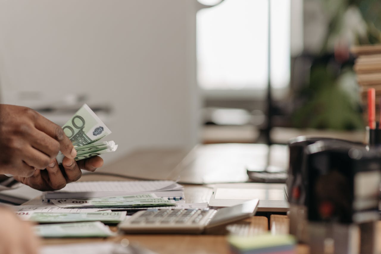 A photo of a person counting bills