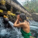 Woman Standing in Front of Flowing Water